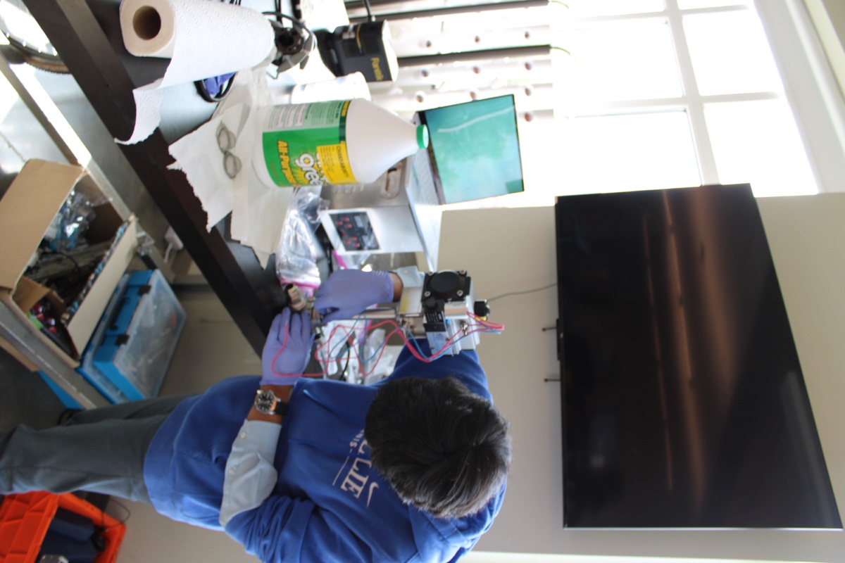 Team member assembling and testing electronics